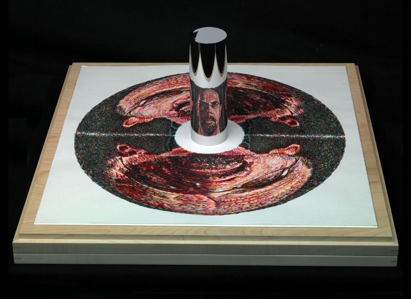 Self-Portrait (anamorphic), 2009
16 color silkscreen on Tosahanga paper, polished stainless steel cylinder, and maple wooden box/platform
27&amp;nbsp;x 27&amp;nbsp;x 11 1/4&amp;nbsp;inches
Edition of 20